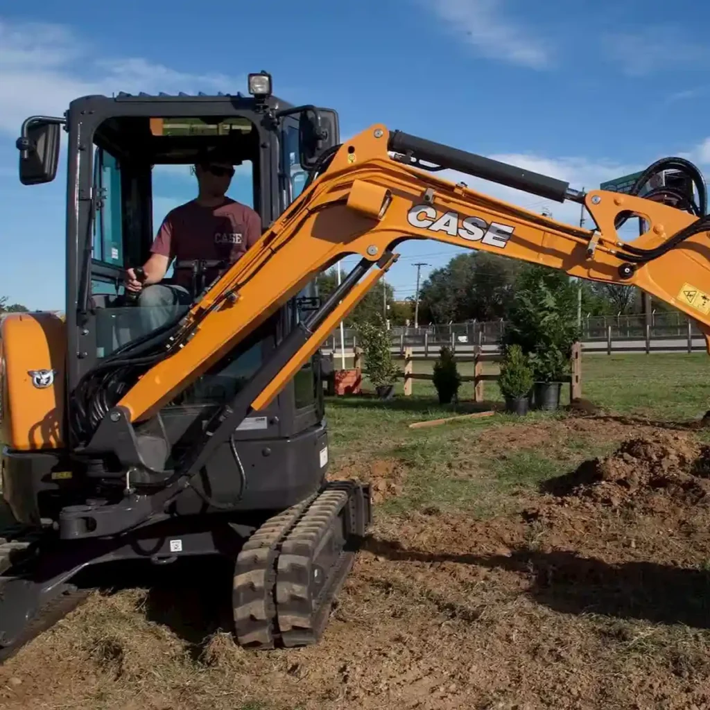 Digger Hire Kapiti leveling a driveway.