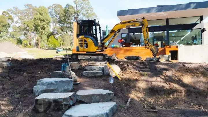 Landscape Construction Kapiti modern outdoor firepit and seating.